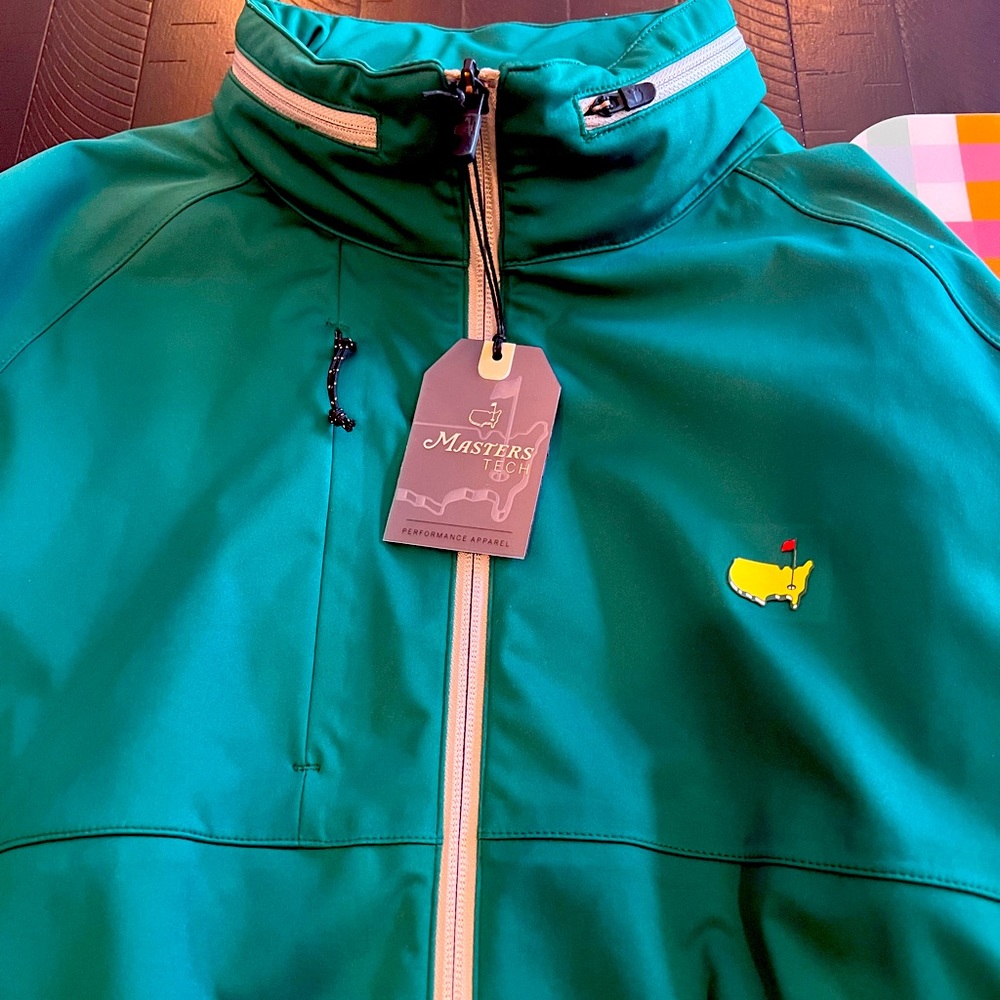 Official Masters rain jacket. Hood in the collar. Size L. Brand new with tags.